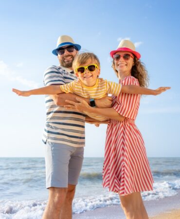 Happy,Family,Having,Fun,On,The,Beach.,Mother,And,Father Happy,Family,Having,Fun,On,The,Beach.,Mother,And,Father
